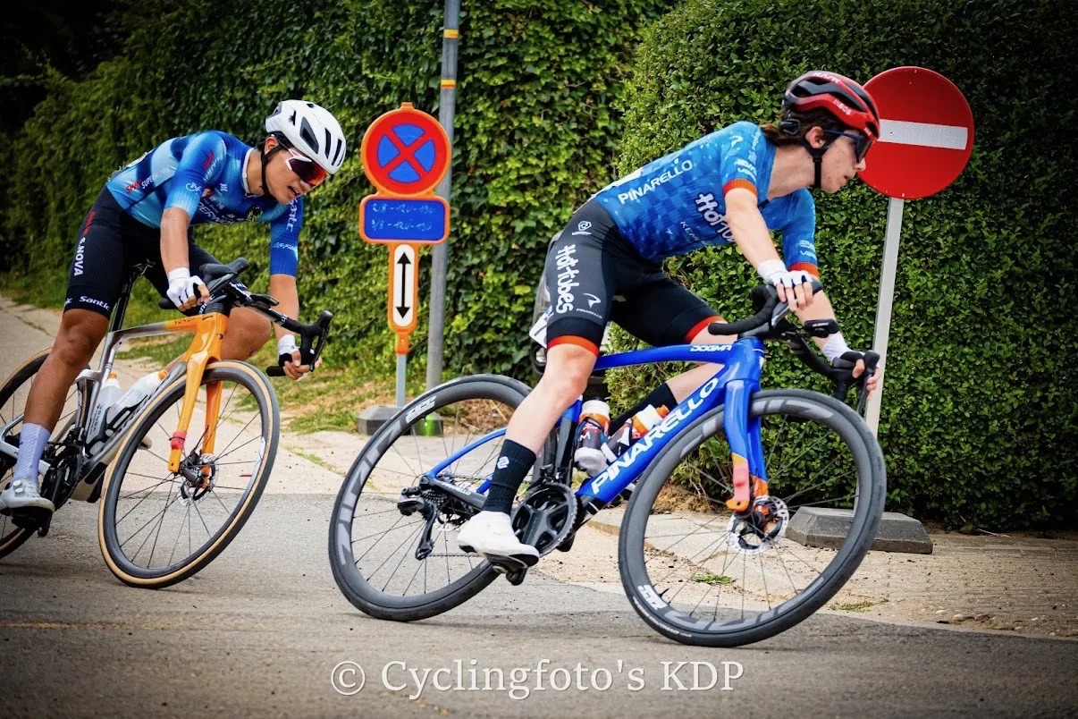 Devin cornering on his blue bike during a road race